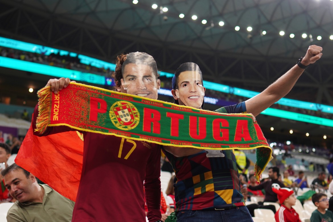 Portugal fans celebrate in the stands.