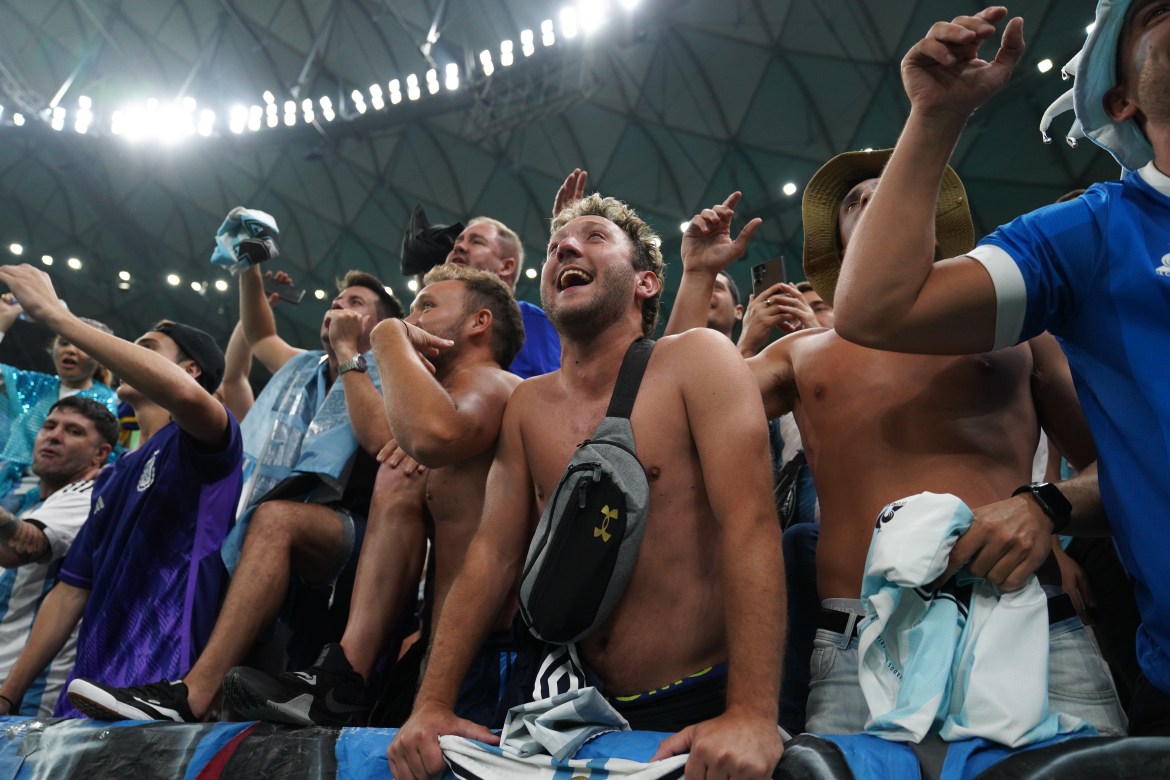Argentina fans celebrate their side’s win in the stands.