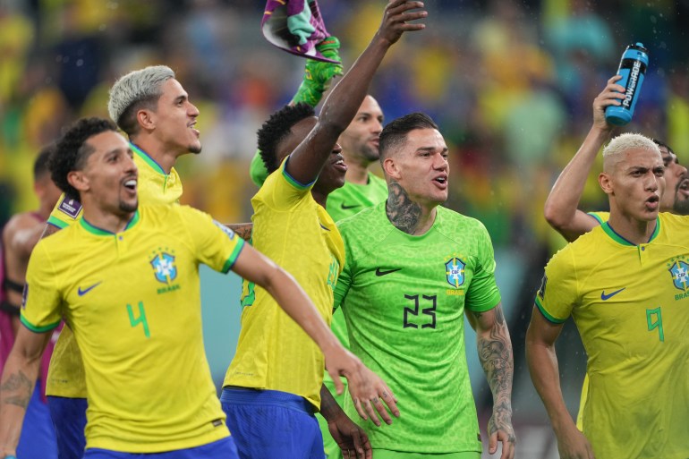 Brazil players celebrating their 4-1 victory.