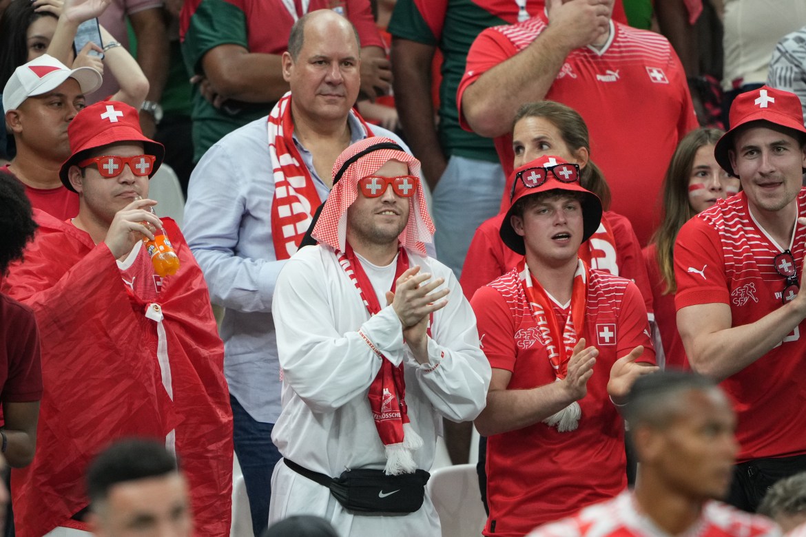 Switzerland fans celebrate in the stands.