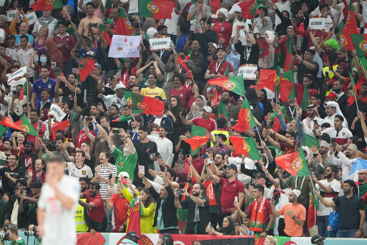 Portugal fans celebrating in the stands after the first goal.