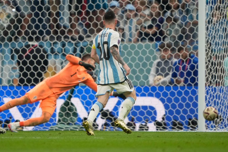 Lionel Messi scores on a penalty against Croatia in the semifinal match.