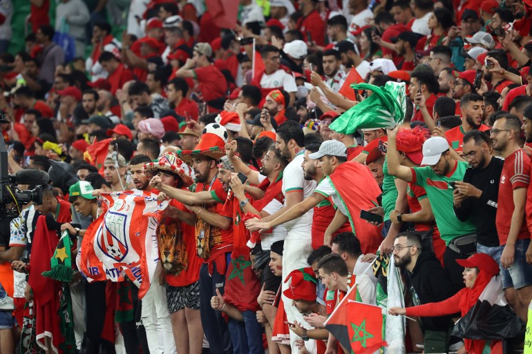 Morocco fans cheer on their side
