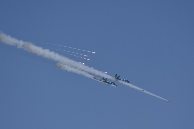 Two Myanmar military jets fire missiles during combined exercise by Myanmar army and air force near Magway in January 2019