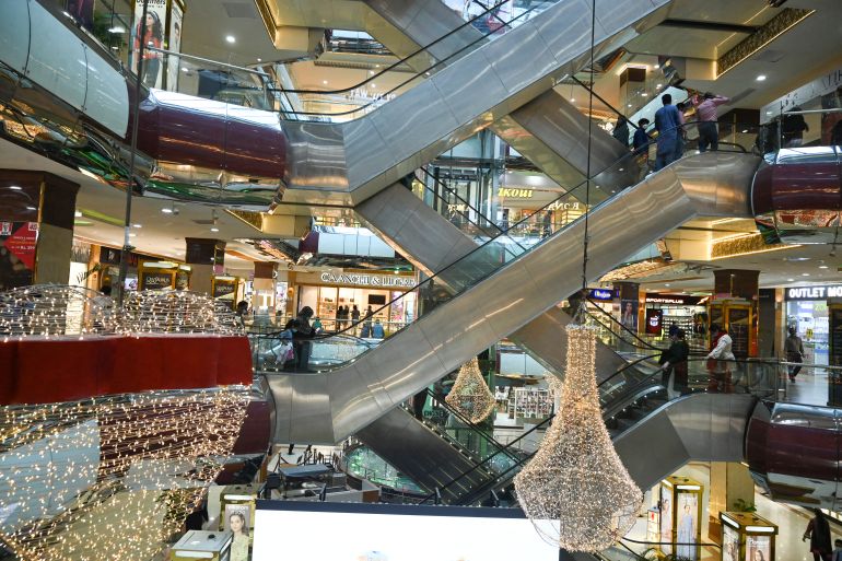 Shoppers are seen inside a shopping mall after the government eased a nationwide lockdown imposed as a preventive measure against the COVID-19 coronavirus