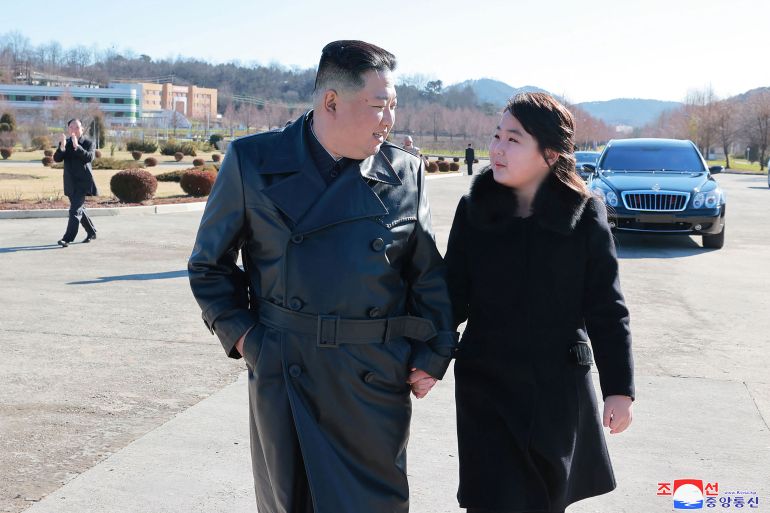 This undated picture released from North Korea's official Korean Central News Agency (KCNA) on November 27, 2022 shows North Korea's leader Kim Jong Un (L) with his daughter (R) as they visit with soldiers who contributed to the test-firing of the new intercontinental ballistic missile (ICBM), at an unknown location in North Korea. - North Korea has conducted a record-breaking blitz of missile launches in recent weeks and fears have grown that it is building up to a seventh nuclear test, its first since 2017. (Photo by KCNA VIA KNS / AFP) / South Korea OUT / REPUBLIC OF KOREA OUT ---EDITORS NOTE--- RESTRICTED TO EDITORIAL USE - MANDATORY CREDIT "AFP PHOTO/KCNA VIA KNS" - NO MARKETING NO ADVERTISING CAMPAIGNS - DISTRIBUTED AS A SERVICE TO CLIENTS / THIS PICTURE WAS MADE AVAILABLE BY A THIRD PARTY. AFP CAN NOT INDEPENDENTLY VERIFY THE AUTHENTICITY, LOCATION, DATE AND CONTENT OF THIS IMAGE --- /