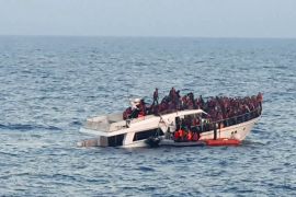 A handout photo provided by the Lebanese Army on December 31, 2022, shows a sinking migrant boat in Mediterranean waters, off the country's northern coast near Tripoli during a rescue operation by the Lebanese navy. - Two migrants, including a child, died when their makeshift boat sank, a security source said, while Lebanon's army said the navy saved 200 people from the stricken vessel off the northern coast. (Photo by Lebanese Army Website / AFP) / RESTRICTED TO EDITORIAL USE - MANDATORY CREDIT "AFP PHOTO / LEBANESE ARMY WEBSITE" - NO MARKETING - NO ADVERTISING CAMPAIGNS - DISTRIBUTED AS A SERVICE TO CLIENTS