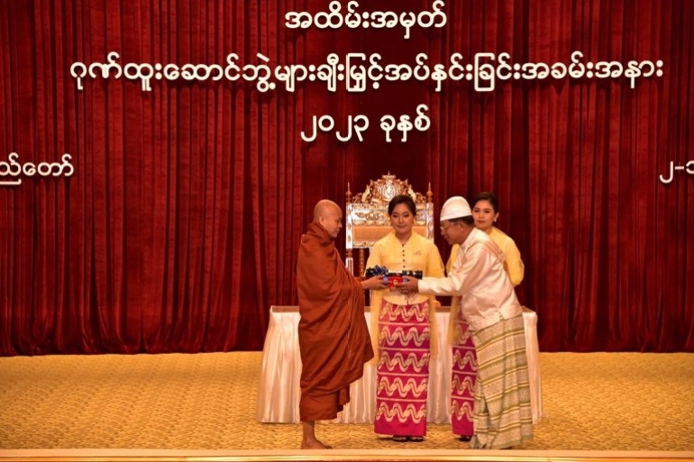 Ultranationalist Buddhist monk Wirathu (left) is presented with an award by the country's military chief Min Aung Hlaing (right) in this photo released on January 2, 2023 [Myanmar Military Information Team via AFP] 