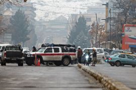 Pictured showing street after a suicide blast in Kabul