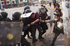 Protesters clash with members of the Peruvian riot police in the city of Cusco, Peru on January 11, 2023 [Ivan Flores/AFP]