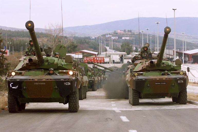 AMX 10 RC tanks of the French First Foreign Cavalry Regiment waits 26 February near the Greek border town of Evzon to enter the Former Yugoslav Republic of Macedonia (FYROM) to join the NATO advance force for Kosovo based in Kumanovo. (ELECTRONIC IMAGE). (Photo by Eric Feferberg / AFP)