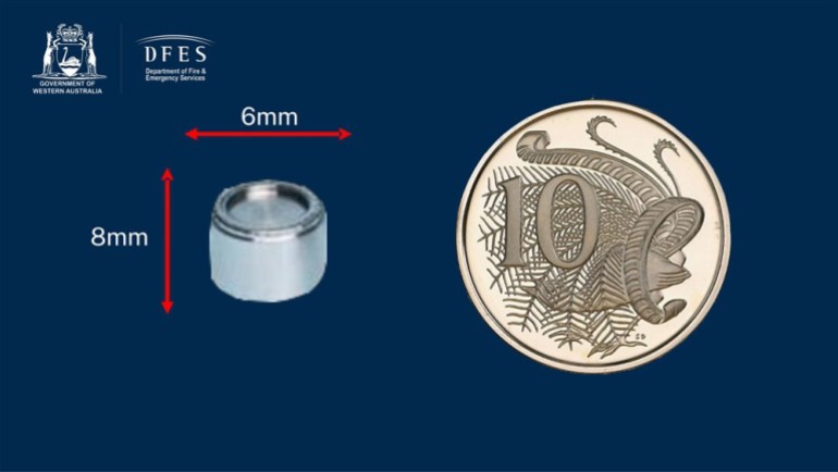 epa10440756 A handout photo made available by the Department of Fire and Emergency Services Western Australia (DFES) on 27 January 2023 shows the size of a small round and silver capsule containing radioactive Caesium-137 compared against a ten pence coin (issued 31 January 2023). A capsule containing radioactive Caesium-137 went missing in transportation between a Rio Tinto mine site north of Newman and the north-eastern parts of Perth between 10-16 January. Radiation surveys are underway along stretches of outback highways in Western Australia. EPA-EFE/DEPARTMENT OF FIRE AND EMERGENCY SERVICES WA HANDOUT EDITORIAL USE ONLY AUSTRALIA AND NEW ZEALAND OUT HANDOUT EDITORIAL USE ONLY/NO SALES