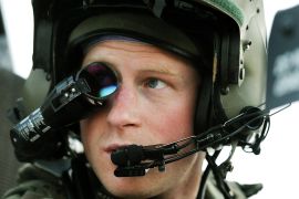 Britain's Prince Harry wears his monocle gun sight as he sits in his Apache helicopter at Camp Bastion, southern Afghanistan.