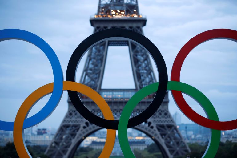 Olympic rings to celebrate the IOC official announcement that Paris won the 2024 Olympic bid are seen in front of the Eiffel Tower