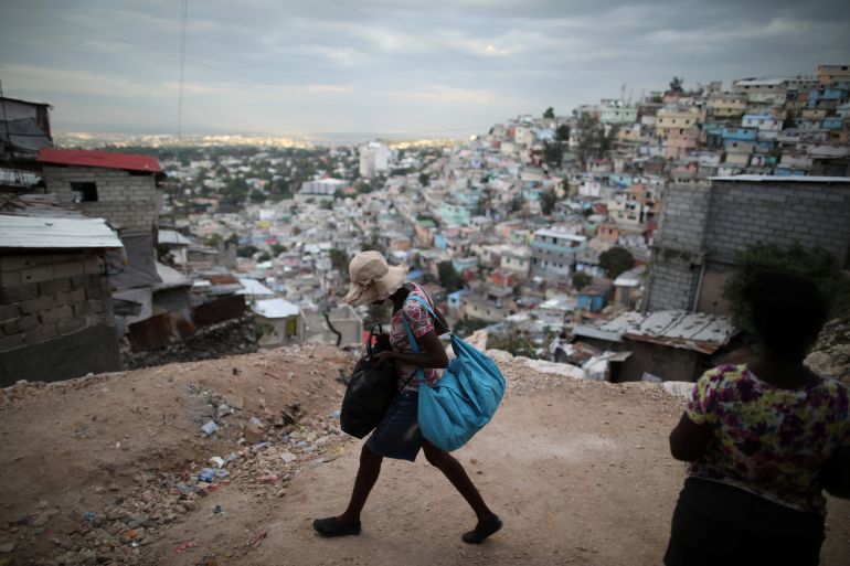 A woman walks in Port-au-Prince, Haiti