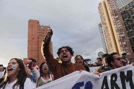 People take part in a protest against the killings of social activists in Colombia