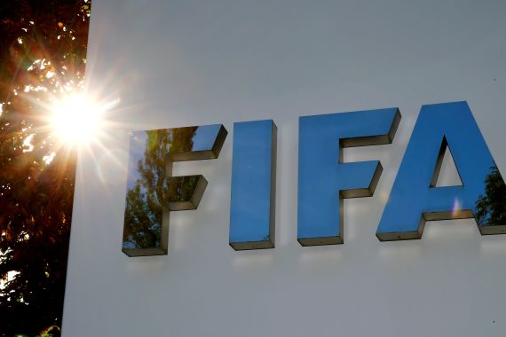 The logo of FIFA on the side of a building