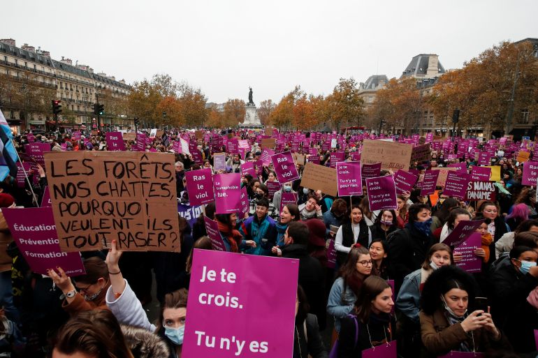People take part in a protest against inequality, violence and sexual harassment against women in Paris