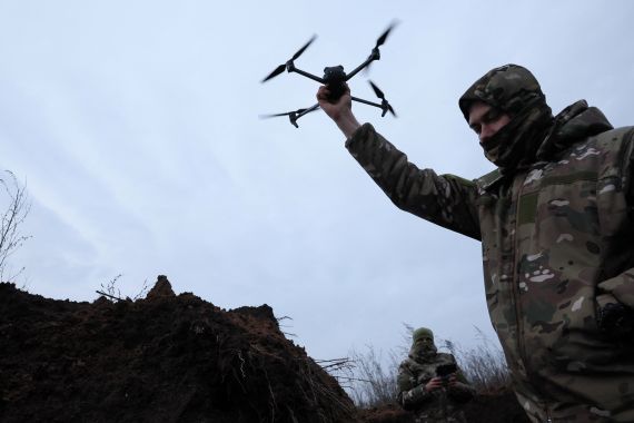 Two soldiers with the 58th Independent Motorized Infantry Brigade of the Ukrainian Army who wanted to be identified as "Ghost", 24, and "Soap", 30, test-fly a drone, as Russia's invasion of Ukraine continues, near Bakhmut, Ukraine, November 25, 2022.
