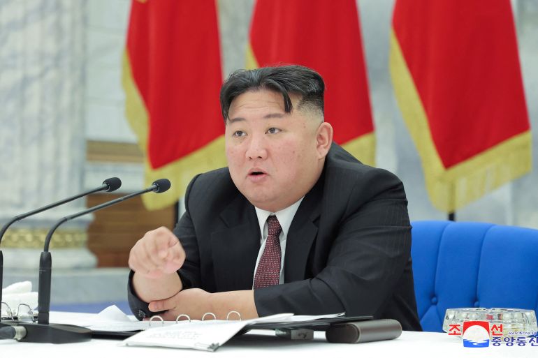 North Korean leader Kim Jong Un speaking at a meeting.