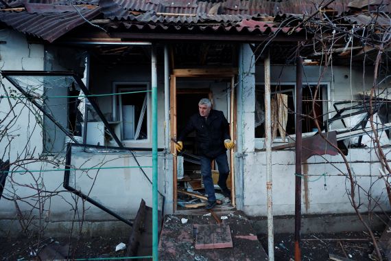 A resident checks his house, damaged by a Russian missile attack in Kyiv, Ukraine.