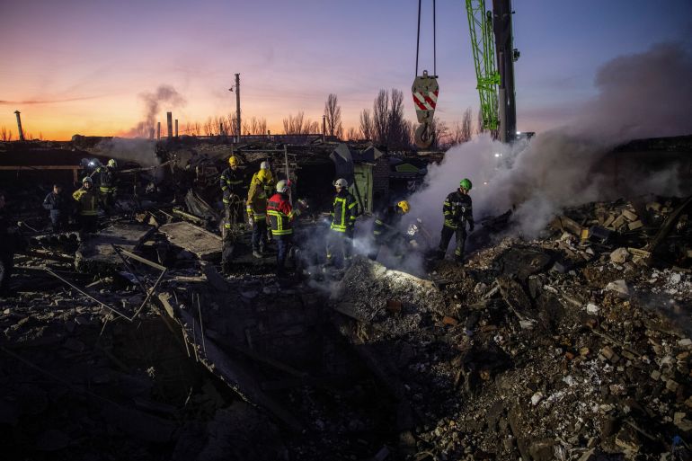 Rescuers work at an area heavily damaged by a Russian missile raid in Ukraine's Mykolaiv.