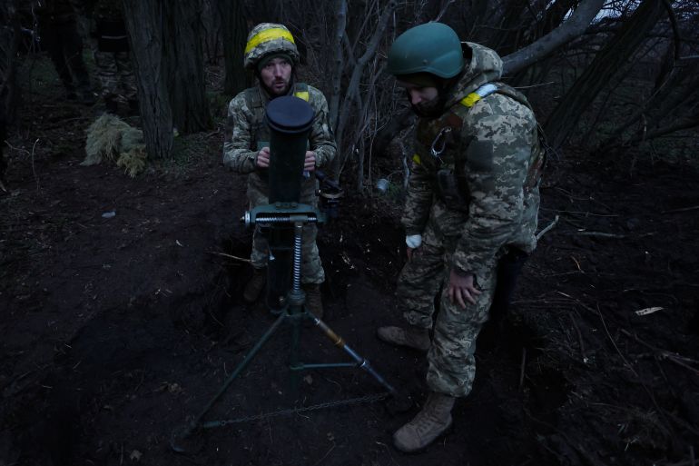 Ukrainian military prepare to fire a mortar round, as Russia's attack on Ukraine continues, in region of Donetsk, Ukraine, December 31, 2022