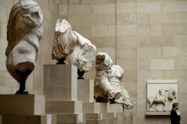 A man looks at the Parthenon Marbles