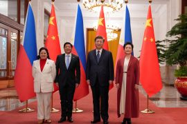 Philippines' President Ferdinand "Bongbong" Marcos Jr. and First Lady Liza Araneta Marcos are photographed with China President Xi Jinping and his wife Peng Li Yuan during a welcoming ceremony at the Great Hall of the People in Beijing