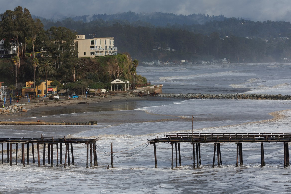 A damaged pier is seen after rainstorms