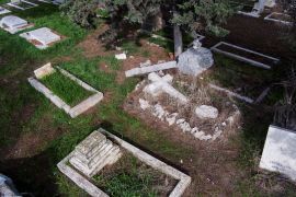 An aerial view shows vandalized tombstones at the Protestant Mount Zion Cemetery where acts of vandalism took place in Jerusalem
