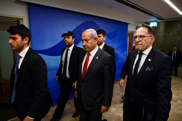 Israeli Prime Minister Benjamin Netanyahu enters a weekly cabinet meeting at the Prime Minister's office in Jerusalem, January 8, 2023.
