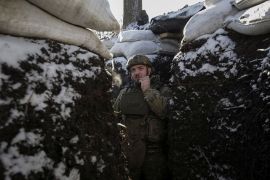 A Ukrainian serviceman stands in a trench on the front line in Donetsk region, Ukraine, January 7, 2023