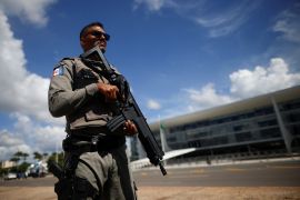A member of the Brazilian National Public Security Force stands in front of the Planalto Palace in Brasilia