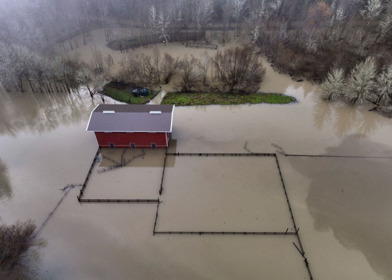 A building in Guerneville, California, stands alone in the midst of floodwaters.