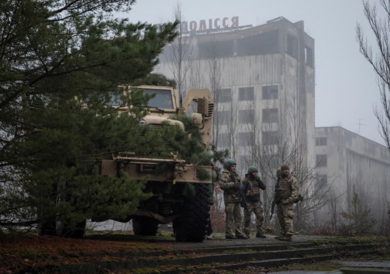 Ukrainian servicemen attend a joint drills of armed forces, national guards, border guards and Security Service of Ukraine (SBU) at the border with Belarus, amid Russia's attack on Ukraine, near the Chernobyl Nuclear Power Plant, in the abandoned city of Pripyat, Ukraine 