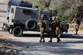 Israeli forces secure an area after attempted stabbing attack near Ramallah, in the Israeli-occupied West Bank, January 21