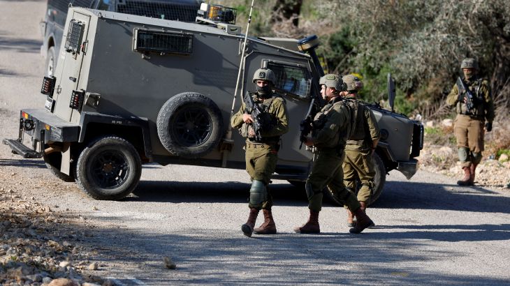 Israeli forces secure an area after attempted stabbing attack near Ramallah, in the Israeli-occupied West Bank, January 21