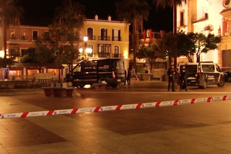 Police officers stand guard at the scene of a stabbing incident at a church in Algeciras