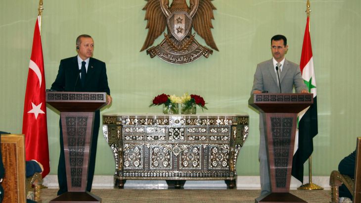 Syrian President Bashar Assad, right, speaks during a joint press conference with Turkish Prime Minister Recep Tayyip Erdogan, left, at al-Shaab presidential palace in Damascus.