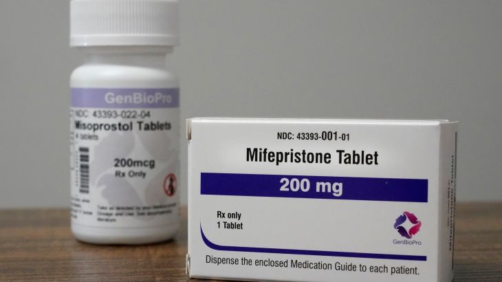 Containers of the medication used to end an early pregnancy sit on a table inside a Planned Parenthood clinic.