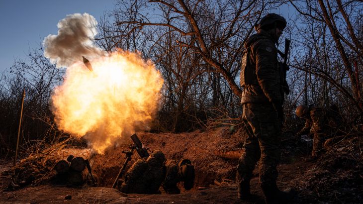 Ukrainian servicemen fire a 120mm mortar towards Russian positions at the frontline near Bakhmut, Donetsk region, Ukraine, Wednesday, Jan. 11, 2023. (AP Photo/Evgeniy Maloletka)