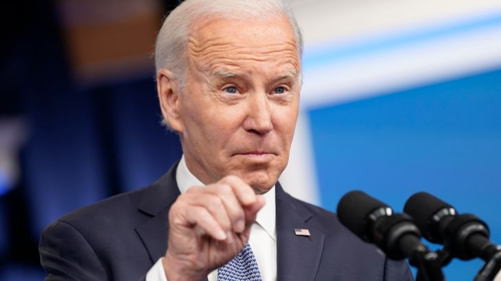 Joe Biden points a finger in a press conference.