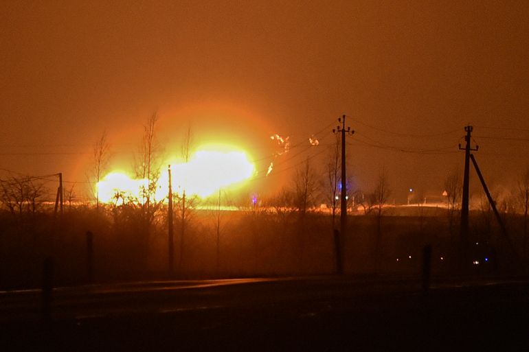 A flame rises after an explosion at a gas pipeline near Pasvalys, 175 km (109 miles) north of Vilnius in northern Lithuania on Friday, Jan. 13, 2023. Officials say an explosion has occurred in a pipeline in central Lithuania carrying natural gas to the north of the country and neighboring Latvia but no supply disruptions or injuries were reported. Baltic media reported that Friday's blast sent flames up to 50 meters (164 feet) into the sky and forced the protective evacuation of a nearby village. (AP Photo/Paulius Zidonis)