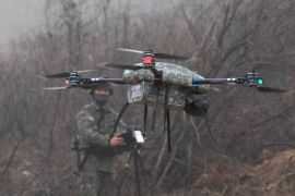 A South Korea army soldier operates his drone during a joint military drill between South Korea and the United States in Paju, South Korea, Friday, Jan. 13, 2023. The drill involved the "Army Tiger Demonstration Brigade", which has been created to support South Korean Army's integration and use of Industry 4.0 technologies. (AP Photo/Ahn Young-joon)