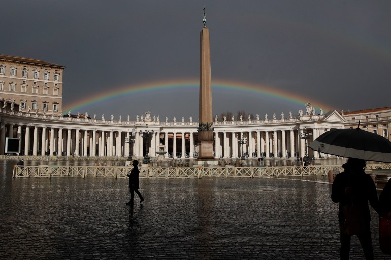 A rainbow shines over St.Peter's Square