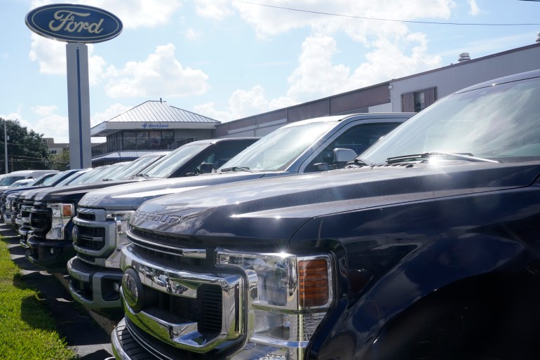 Ford F150 trucks are displayed at a Gus Machado dealership in Florida, US
