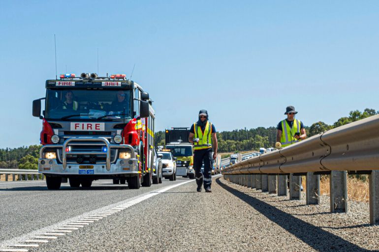 The Department of Fire and Emergency Services members search for a radioactive capsule believed to have fallen off a truck being transported on a freight route on the outskirts of Perth, Australia, Jan 28, 2023