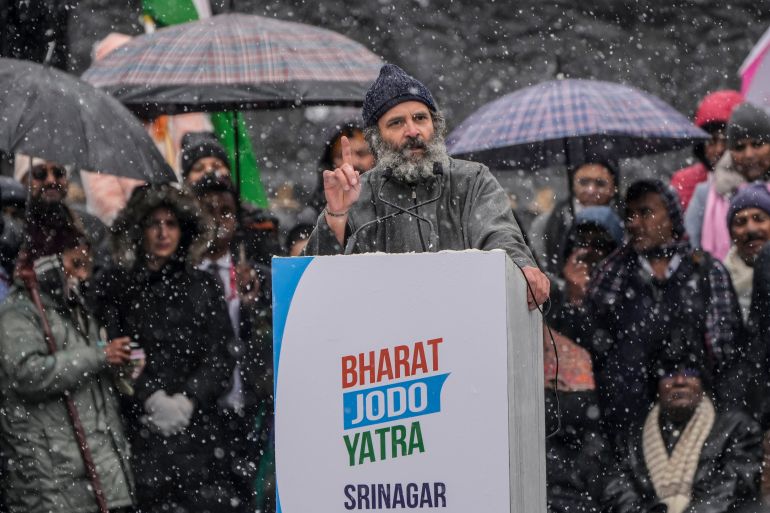 India's opposition Congress party leader Rahul Gandhi, speaks at a public rally as it snows in Srinagar