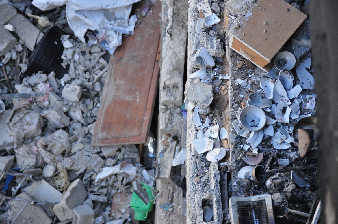 Broken dishes lie among the rubble of a house - the site of the deadly Israeli raid.